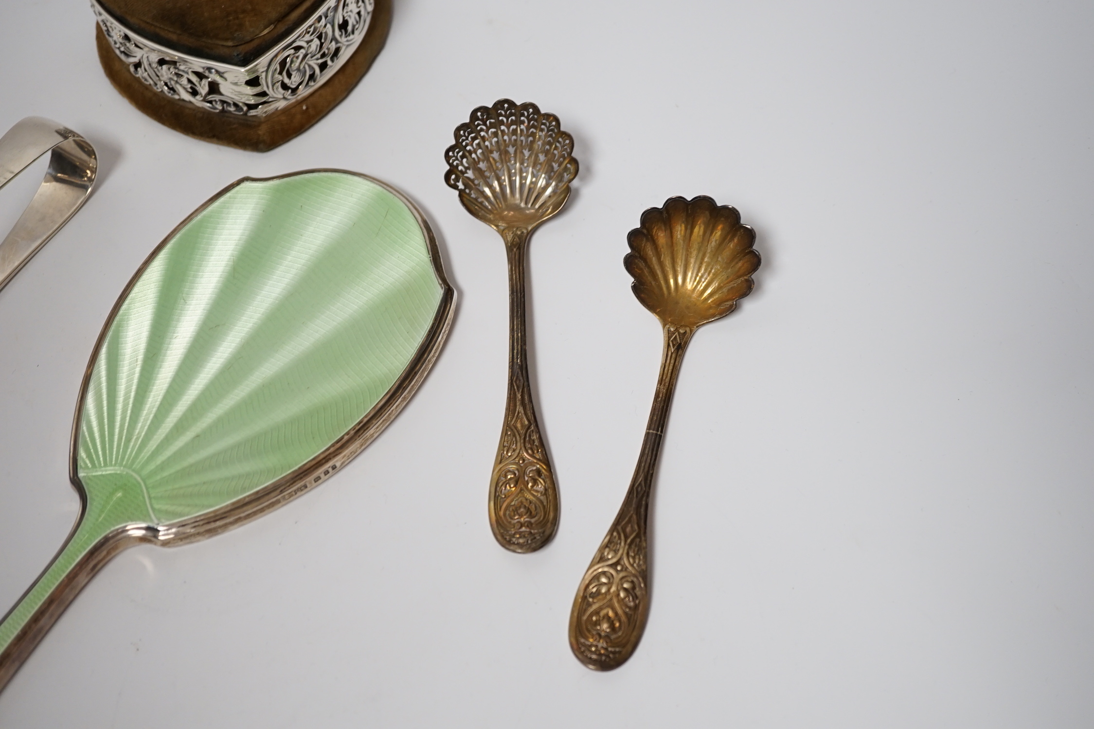 A Georgian silver wine funnel, 11.7cm (a.f.), a pair of silver servers, a pair of Victorian silver sifter spoons, George Adams, London, 1859, a silver and enamel mounted hand mirror and a George V pierced silver mounted